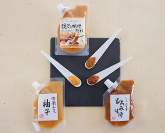 A collection of three specialty miso sauces displayed together: Dengaku Miso, Gyoza Miso Sauce, and Moromi Miso